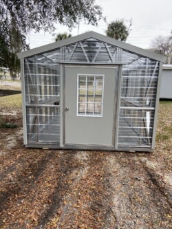 10x16 Greenhouse with Fan 9 Lite Door Electric Composite Floor Shelving Front View Gainesville FL, located in Gainesville, FL.